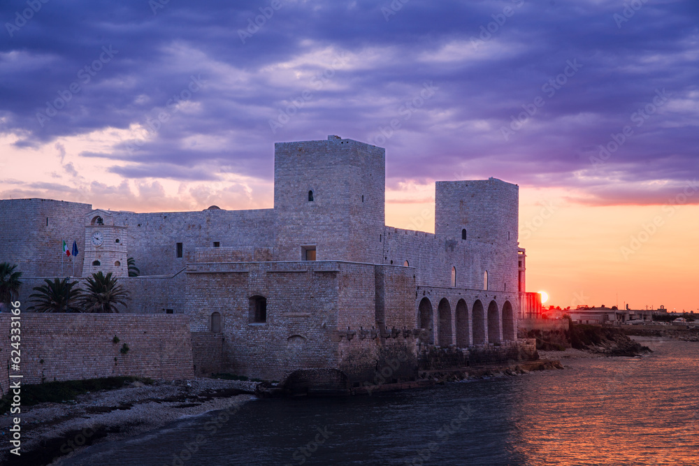 View of the Svevo Castle at sunset, Trani, Italy