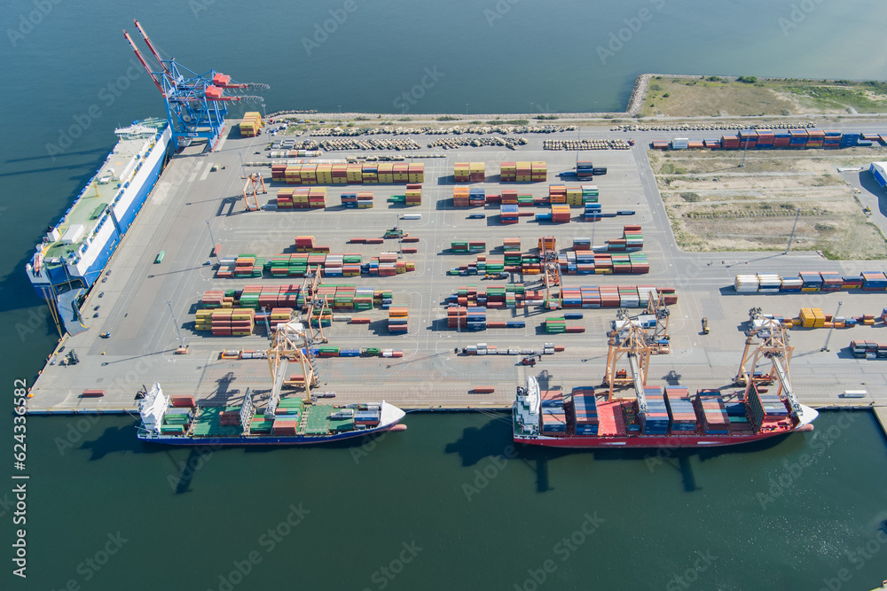 Logistic port, cargo ships and containers, military equipment.  Drone view.