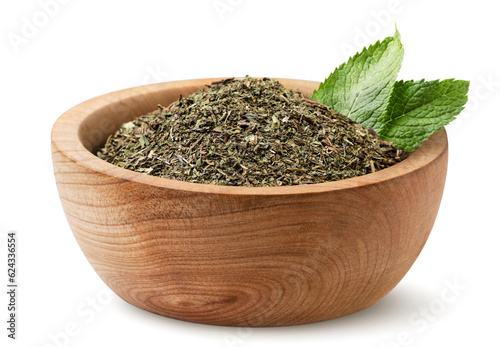 Dried mint in a wooden plate with leaves on a white background. Isolated