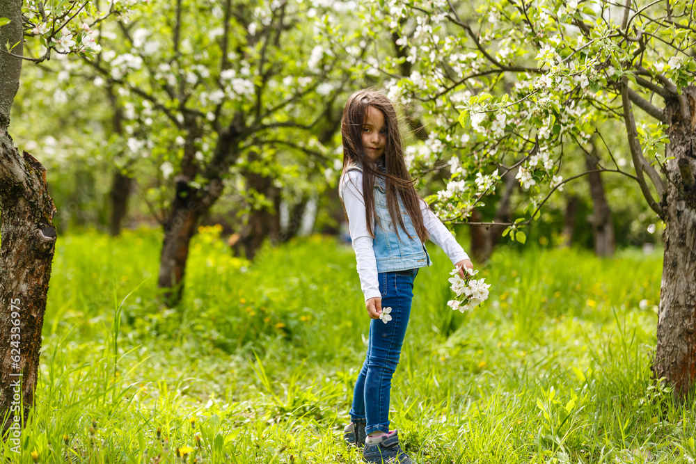 Portrait beautiful little girl near blossoming apple-tree. Portrait beautiful little girl near blossoming apple-tree.