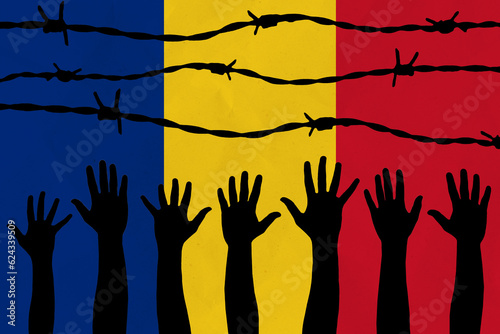 Romania flag behind barbed wire fence. Group of people hands. Freedom and propaganda concept
