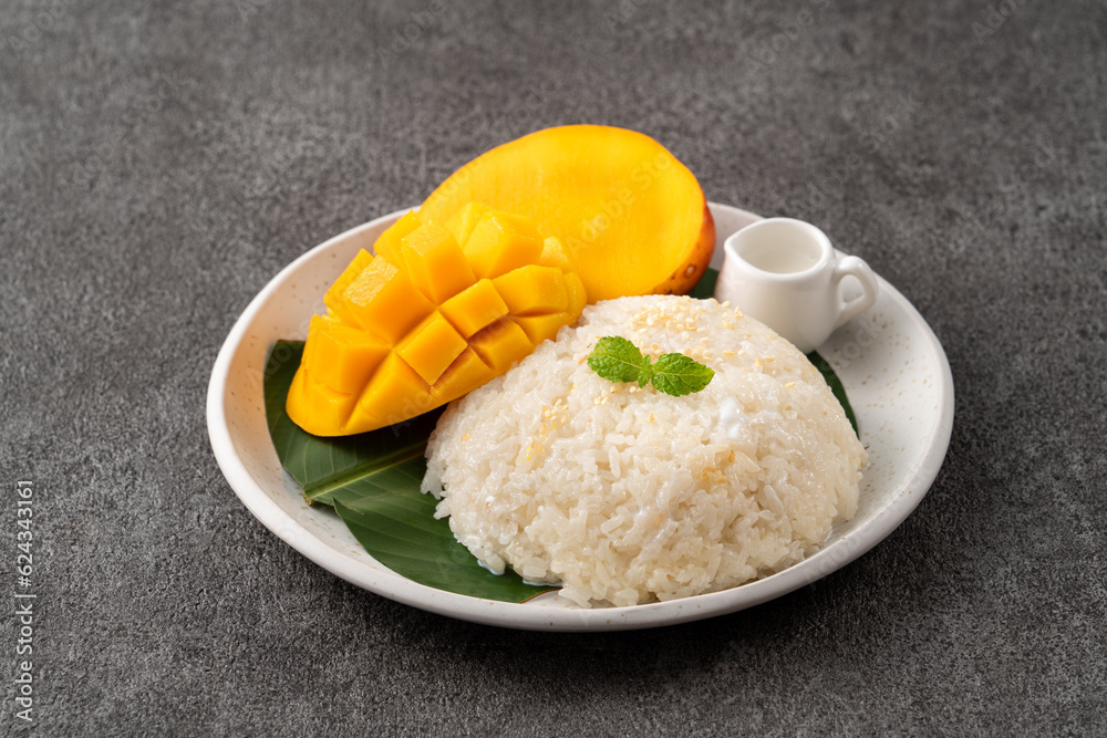 Delicious Thai mango sticky rice with cut fresh mango fruit in a plate. Delicious Thai mango sticky rice with cut fresh mango fruit in a plate.