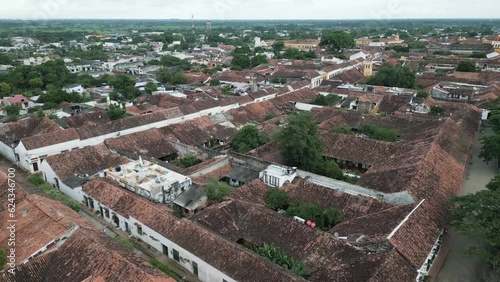 Aerial above Santa Cruz de mompox colonial town village with traditional old architecture buildings in Colombia Bolivar department drone fly above city center historical  photo