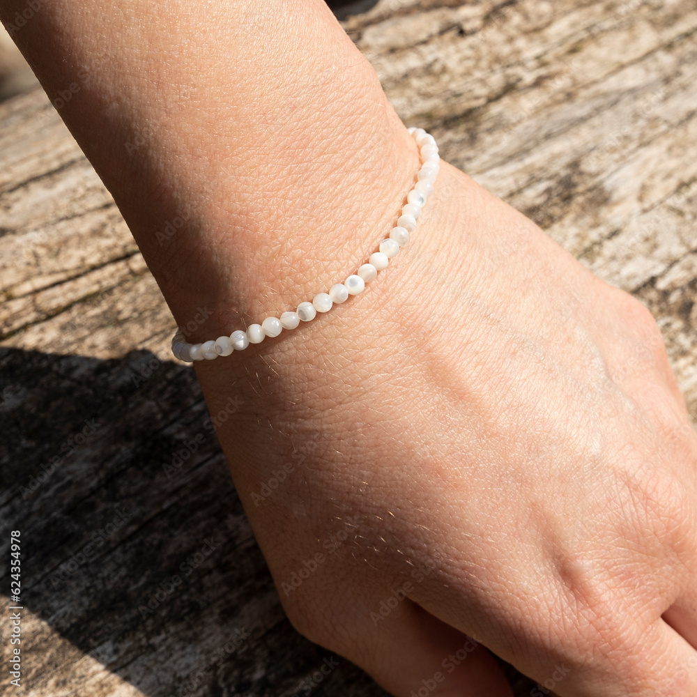 Gemstone beaded bracelet. Energy crystals, healing stone jewelry. Handmade accessories.
Mother of pearl, silver.