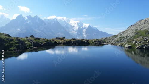 Lake Blanc at the end of Tour Mont Blanc  surrounded with snowy mountains