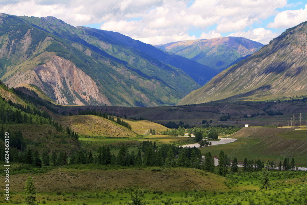 Village of Chibit, Altai Republic, Russia - 06/28/2022. Landscape with forest and mountains, Chuya river