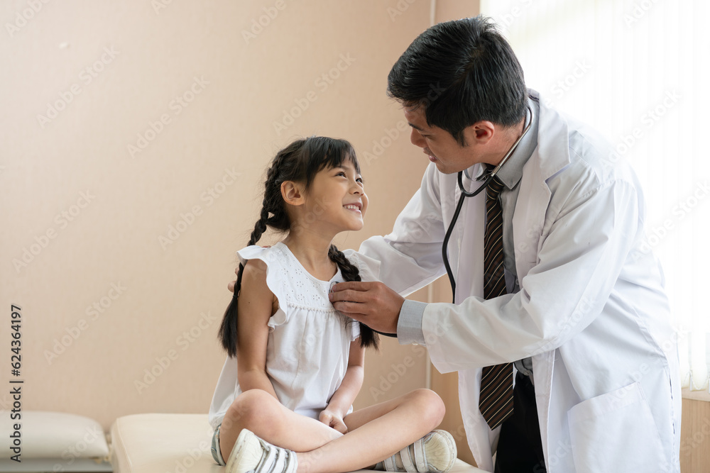 Doctor using stethoscope examining little girl patient at hospital. Medicine and health care concept. Doctor using stethoscope examining little girl patient at hospital. Medicine and health care concept.