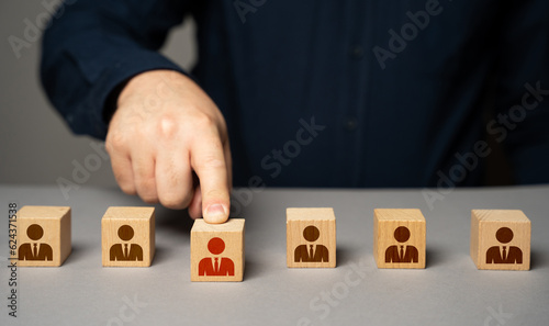 Selected highlighted person from the group. Present an employee with a promotion. Hiring by competition. Get a raise. Select and designate an employee for higher post. Career advancement.
