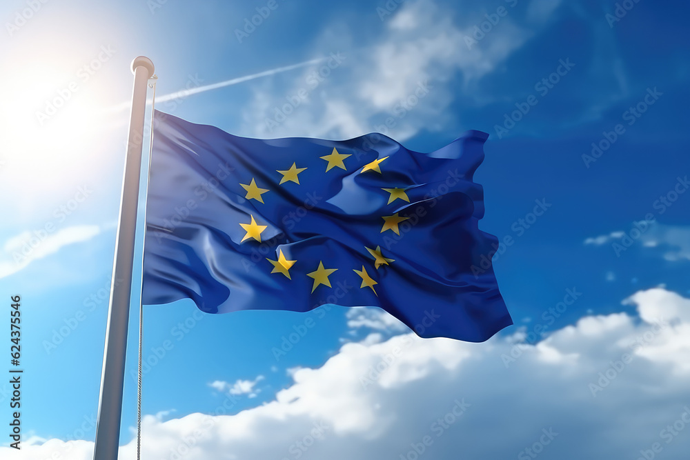 European flag flying in the wind on a flagpole against a blue sky with clouds. Blue flag of the European Union wallpaper.  