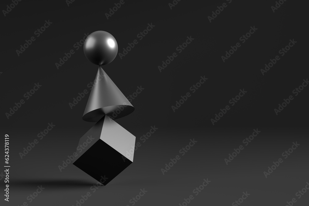Black metallic geometrical shapes balancing on top of each other. Black metallic geometrical shapes balancing on top of each other.