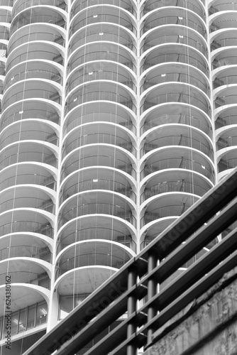 View of one of the circular shaped parking buildings, seen from the River Walk in Chicago, Illinois © Marquicio