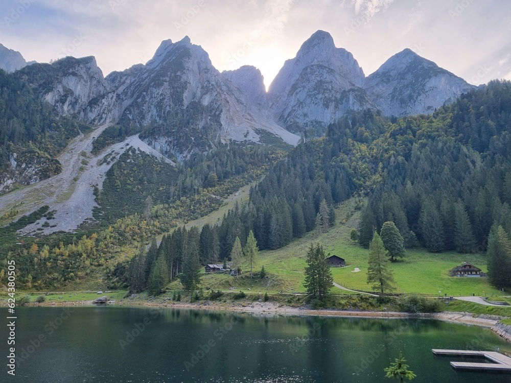 Gosauseen Lake hike in Austria, Europe, surrounded by snowy mountains and autumn trees