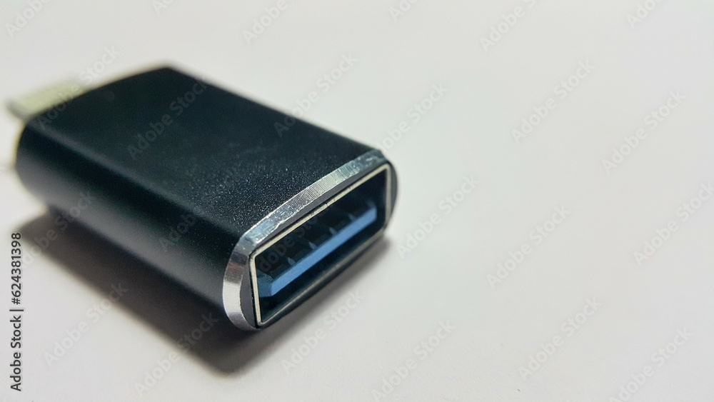 Close up view of 8 pin to micro USB 3.0 adapter on white background to transfer data on the smartphone Close up view of 8 pin to micro USB 3.0 adapter on white background to transfer data on the smartphone