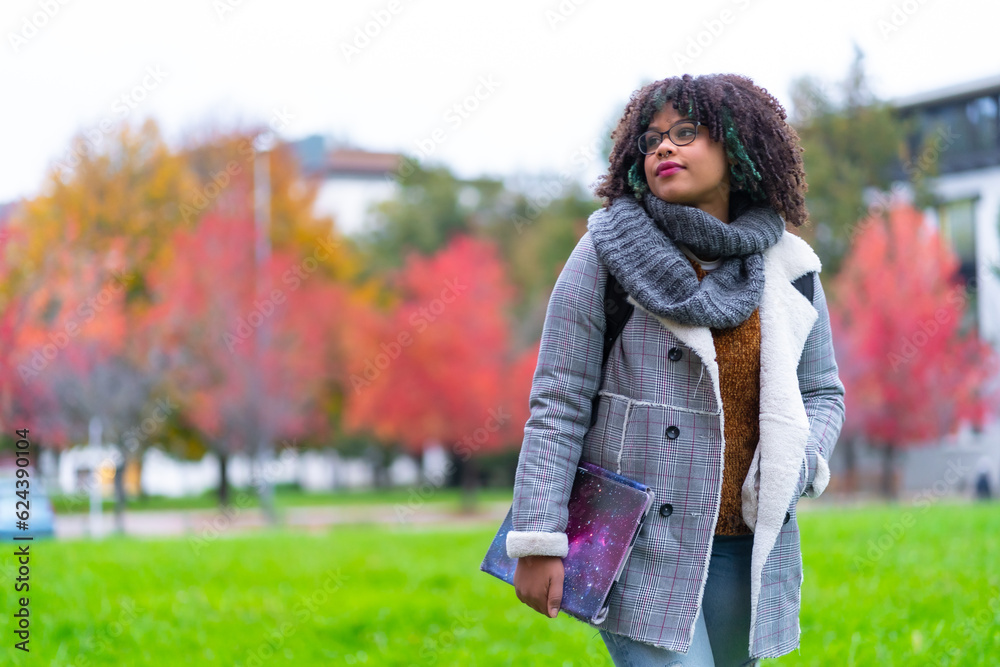 Portrait of black ethnic girl in college in autumn with college in background, back to school Portrait of black ethnic girl in college in autumn with college in background, back to school