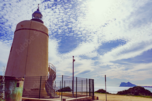 Lighthouse and Gibraltar rock, La Alcaidesa, Spain. photo