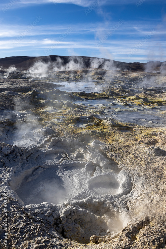 Fototapeta premium Stunning geothermic field of Sol de Mañana with its steaming geysers and hot pools with bubbling mud - just one sight on the lagoon route in Bolivia, South America