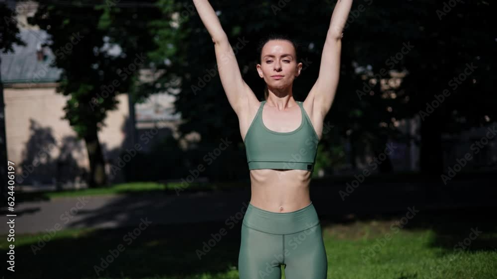 Pretty free and wild healthy woman standing in meditation pose outdoor in the morning medicine yoga asana balance energy hand stretching sport practice good for woman health mindfulness at sunrise. Pretty free and wild healthy woman standing in meditation pose outdoor in the morning medicine yoga asana balance energy hand stretching sport practice good for woman health mindfulness at sunrise.