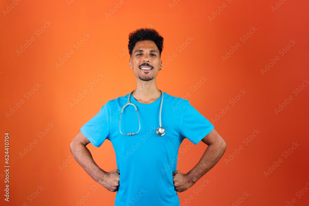 New Doctor or Veterinarian Isolated. Black Young Resident With Stethoscope on Orange Background. New Doctor or Veterinarian Isolated. Black Young Resident With Stethoscope on Orange Background.