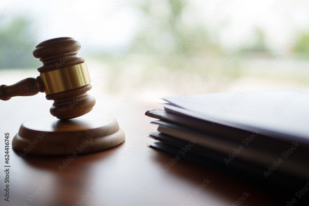 Close up Mallet of the judge at law firm of courtroom.