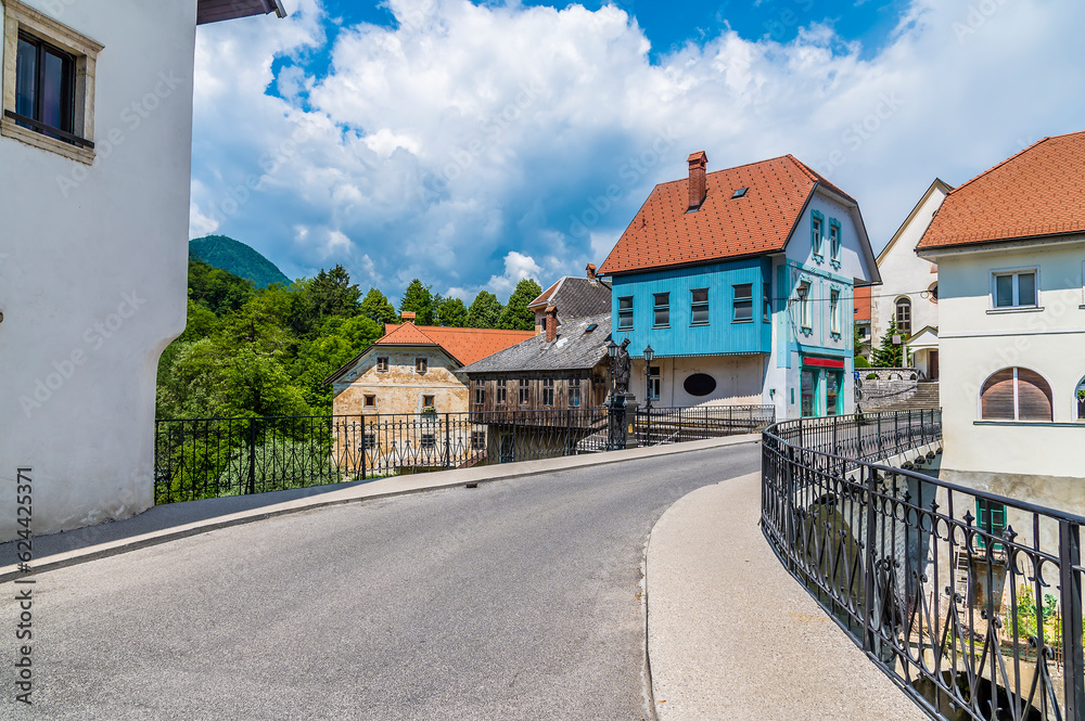 A view across the fourteenth century, Capuchin bridge in the old town of Skofja Loka, Slovenia in summertime
