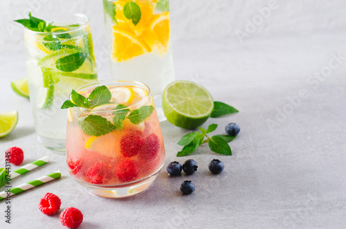 Summer Drinks Set, Fruit, Citrus and Berry Refreshing Lemonade or Cocktails on Bright Background