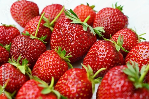 Strawberries. Healthy fresh summer fruit. Background with food. Yoghurt with fresh fruit