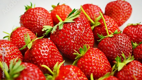 Strawberries. Healthy fresh summer fruit. Background with food. Yoghurt with fresh fruit