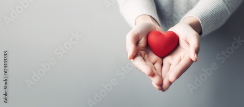 Hand hold heart shape, white background. AI Generative