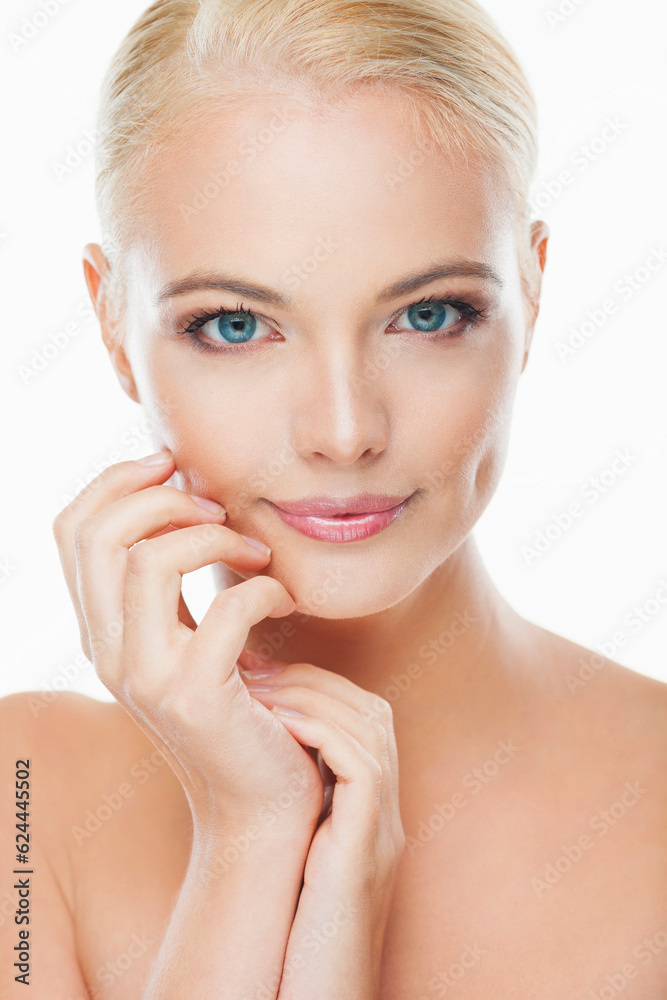Portrait of a young woman with blonde hair and blue eyes looking at the camera with a white background Portrait of a young woman with blonde hair and blue eyes looking at the camera with a white background