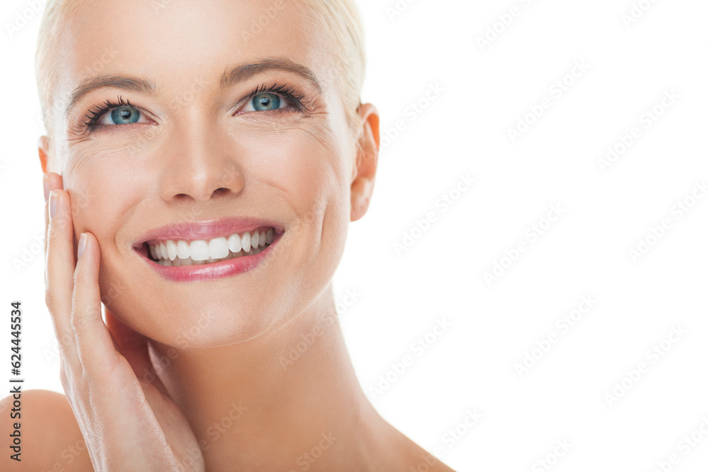 Obraz premium Portrait of a young woman with blonde hair and blue eyes looking at the camera with a white background