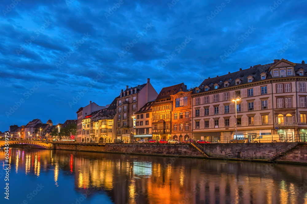 Naklejka premium Strasbourg France, colorful Half Timber House night city skyline and Ill river