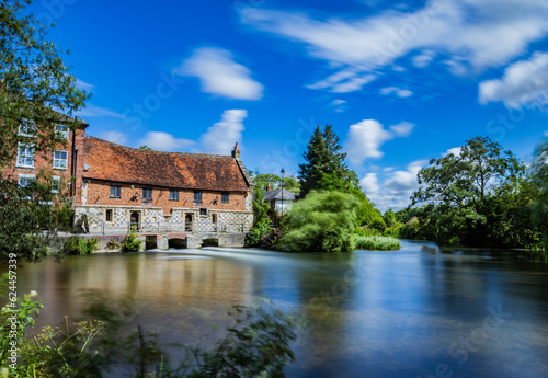 Old Mill and river with countryside, United Kingdom photo