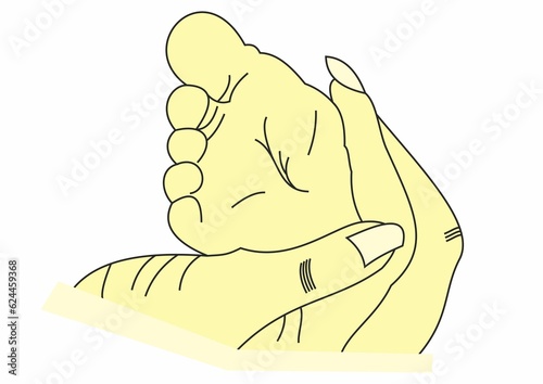 adult's hand holding baby's leg