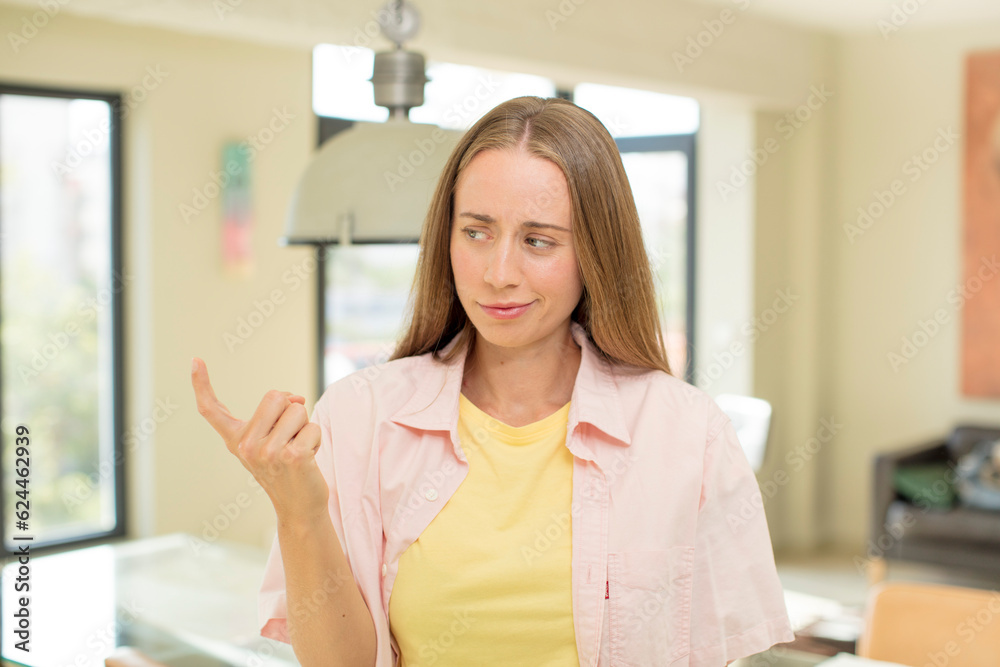 pretty blond woman feeling happy, successful and confident, facing a challenge and saying bring it on! or welcoming you pretty blond woman feeling happy, successful and confident, facing a challenge and saying bring it on! or welcoming you