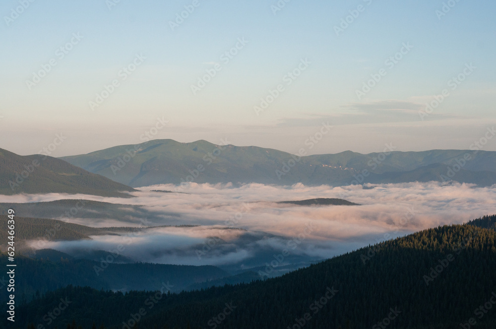 landscape sky clouds low in the mountains the sun rises, fog, above the clouds, wallpaper, poster, cover, the nature of the Carpathian mountains, green, natural beauty, vacation, outdoor