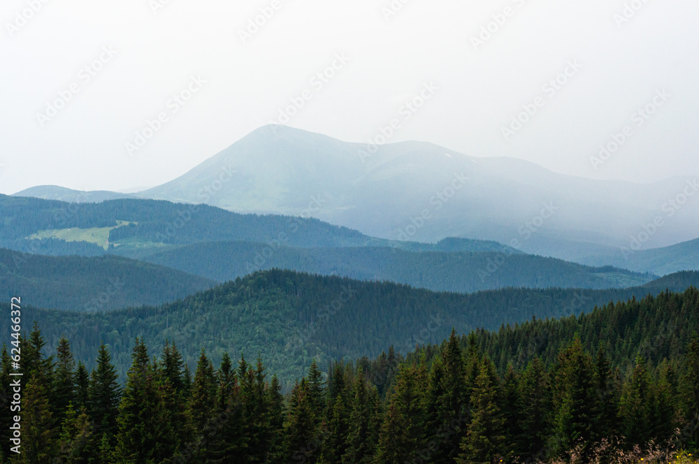 landscape the sky before a thunderstorm, clouds in the mountains before the rain, a cloud is approaching, fog, above the clouds, wallpaper, poster, cover, nature of the Carpathian mountains, green