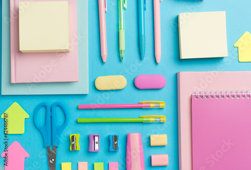 Flat lay with colorful school stationery on color backgroung, top view