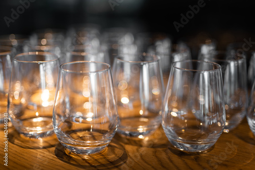 empty clean glass glasses for alcoholic drinks in a restaurant on a bar counter