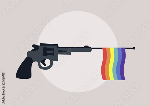 A toy gun with a rainbow flag targeted against LGBTQ people, homophobia and discrimination