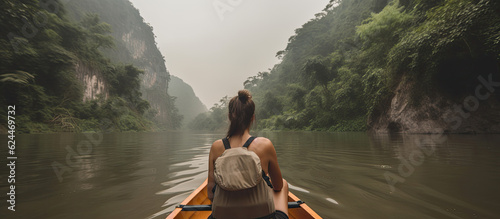 Rear view of person in a trip to mountains by boat