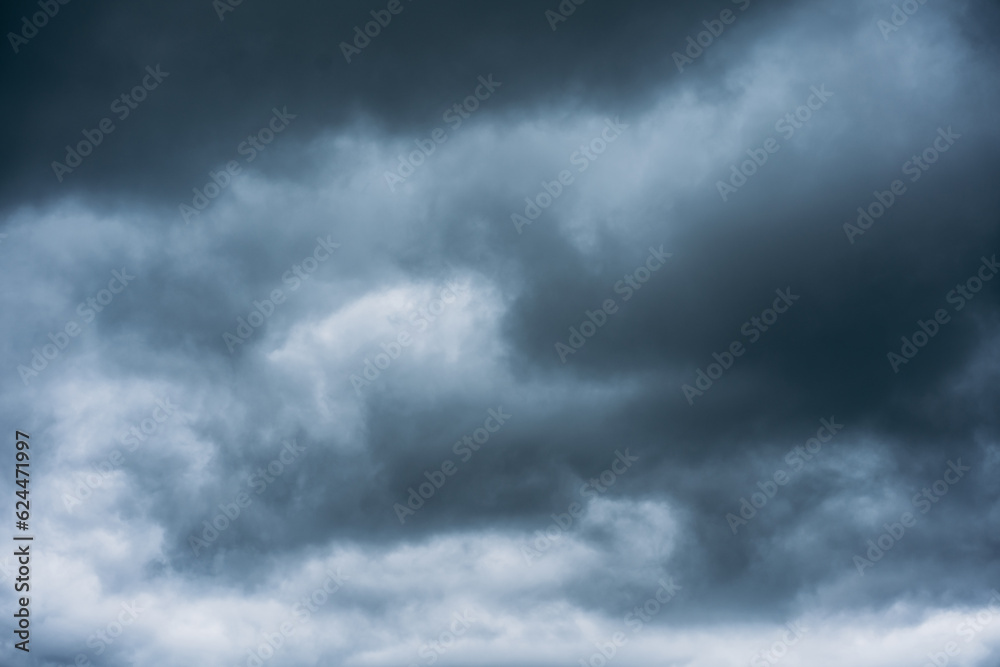 Overcast sky with dark clouds. Dark sky before a thunder-storm. The gray cloud background before rain.