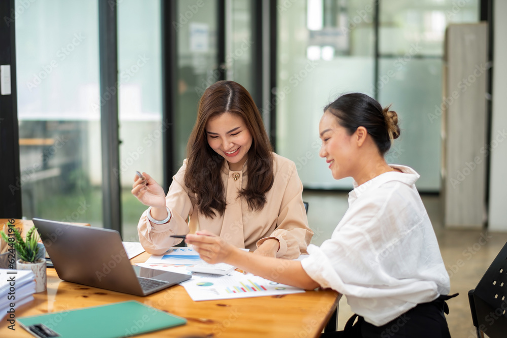 Two colleague businesswoman discussion and brainstorming business ideas. Consulting and marketing planning Two colleague businesswoman discussion and brainstorming business ideas. Consulting and marketing planning