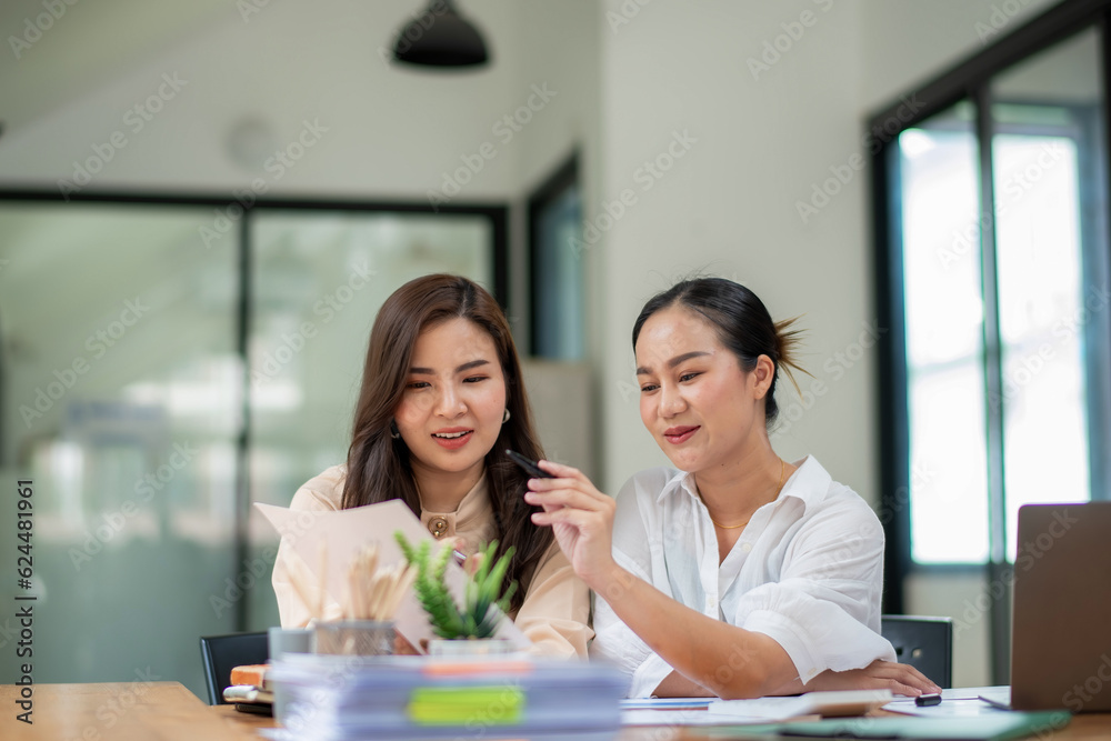Two colleague businesswoman discussion and brainstorming business ideas. Consulting and marketing planning Two colleague businesswoman discussion and brainstorming business ideas. Consulting and marketing planning