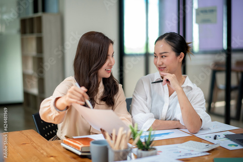 Two colleague businesswoman discussion and brainstorming business ideas. Consulting and marketing planning