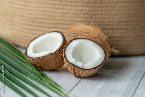 Fototapeta Naklejka Na Ścianę i Meble -  Coconut advertising poster image, fresh coconut with palm leaf 