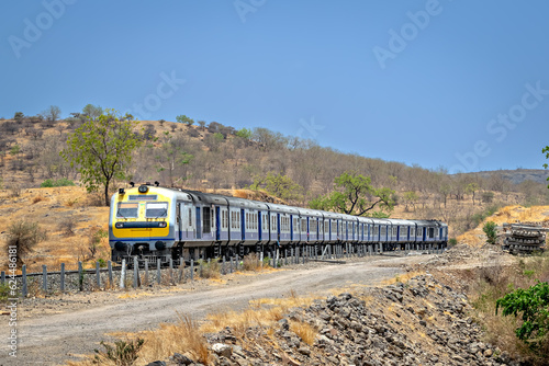 Photography Local passenger train passing through hilly railway line in Daundaj, Maharashtra