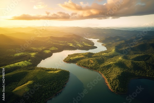 aerial view of a lake in green hills during sunset photo