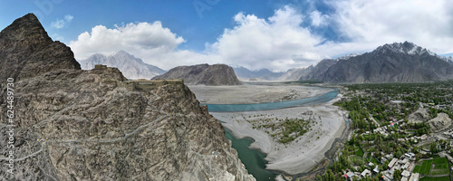 A 180-degree aerial panorama of Skardu Valley, Indus River delta, and Kharpocho Fort located on a mountain overlooking the entire valley in Skardu, Pakistan photo
