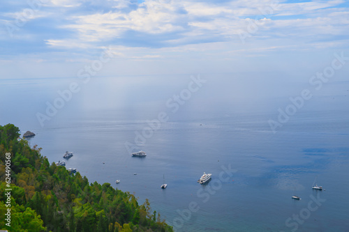 View of the blue sea from Taormina towards the bay in Giardini Naxos, Sicily, Italy