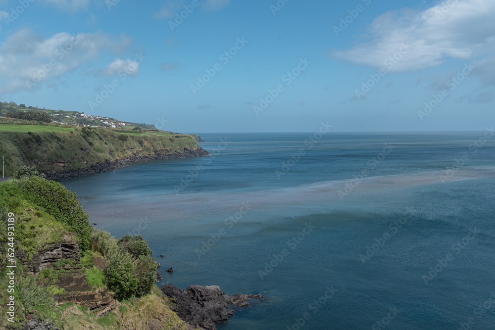 Landscape in Sao Miguel island with volcanic rocks touching the sea. Landscape in Sao Miguel island with volcanic rocks touching the sea.
